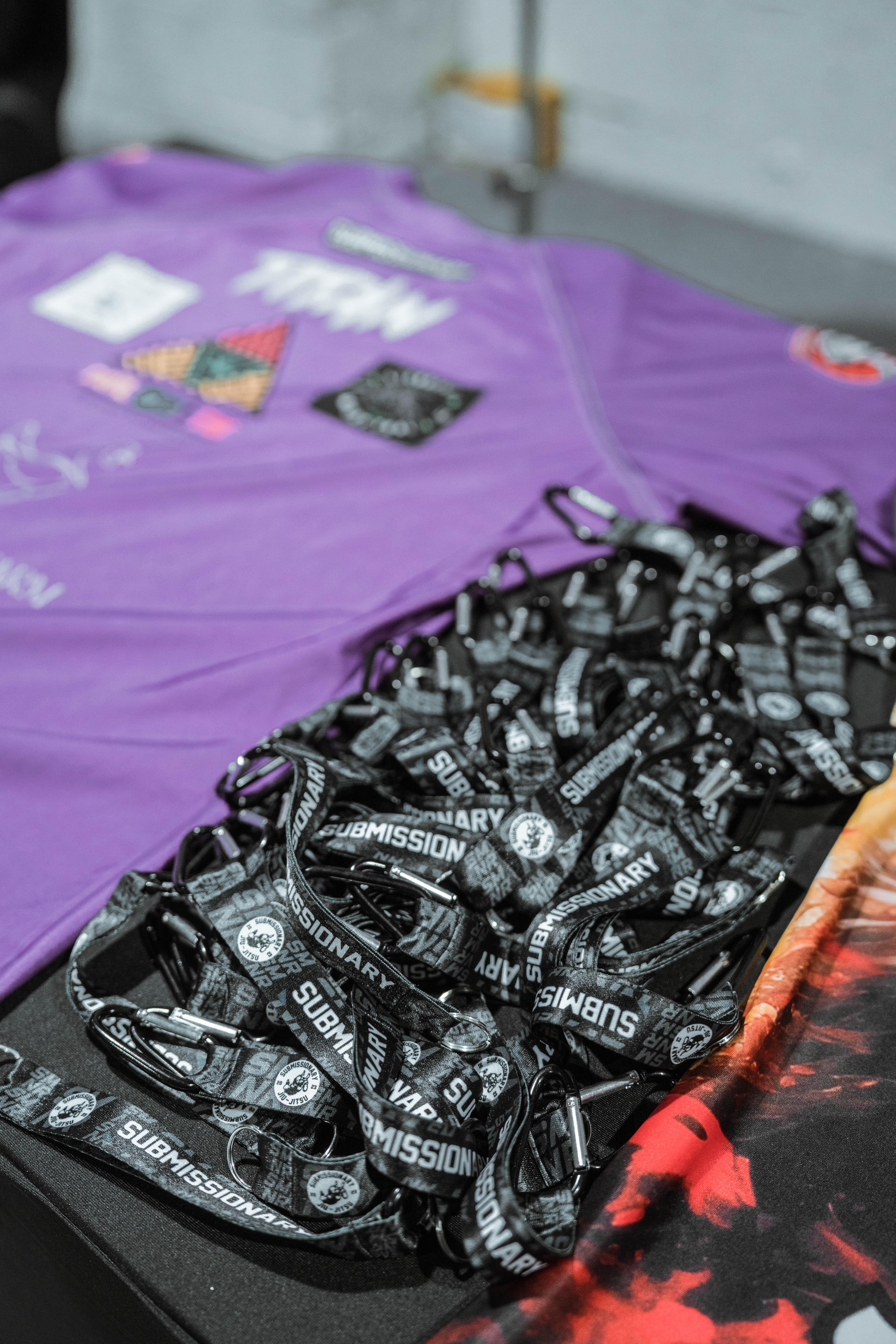 Submissionary lanyards and kit displayed at an event stand