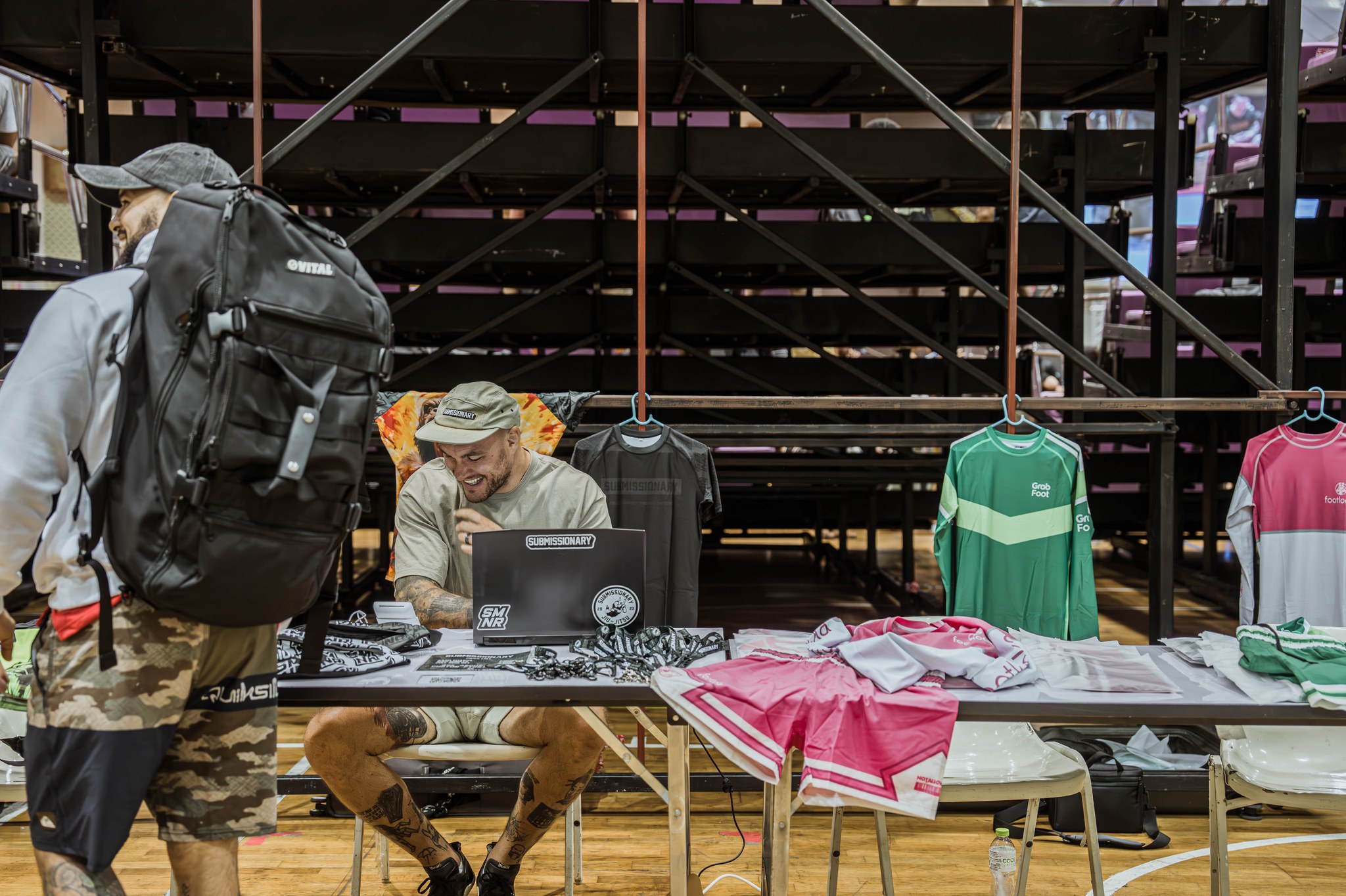 Submissionary pop-up stand beside tournament seating